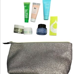 gray makeup bag with mini skincare/beauty products